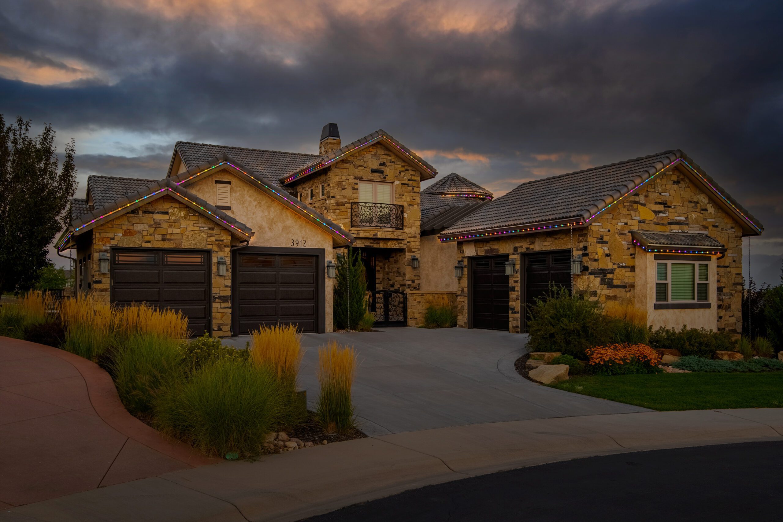 Home with permanent holiday lights in Easter egg color palette