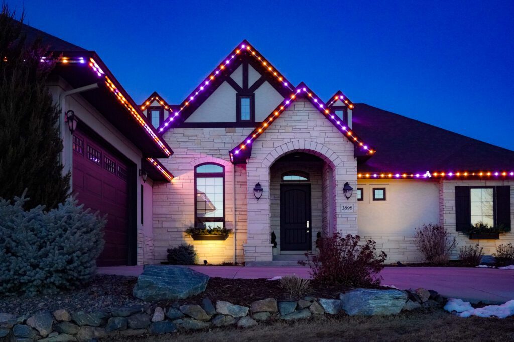 Decorated eaves with permanent holiday lights for Halloween