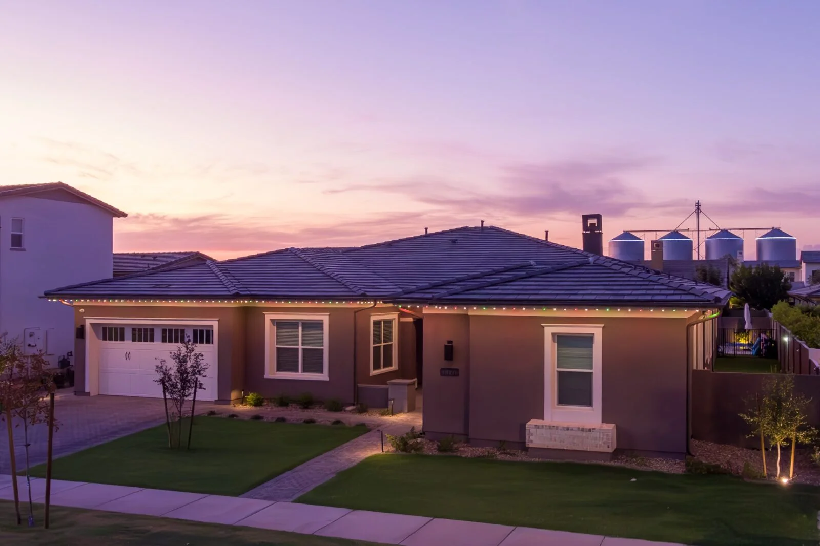 Arizona home with permanent holiday lighting in Red, Green, and White for Christmas