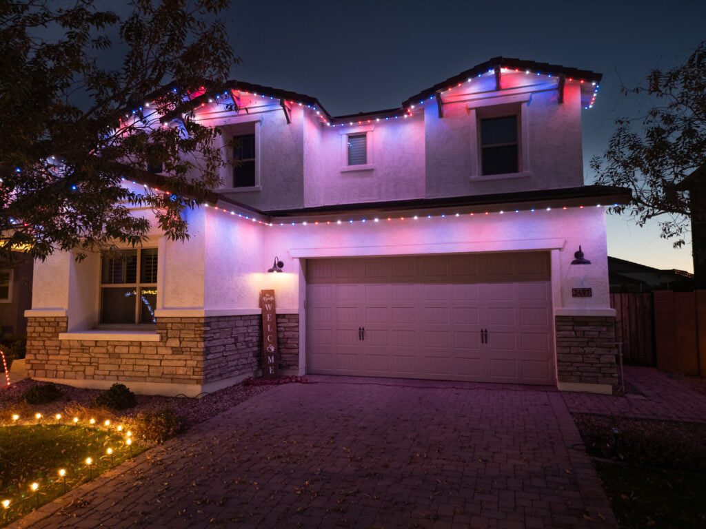 White home with permanent trim lighting in red white and blue